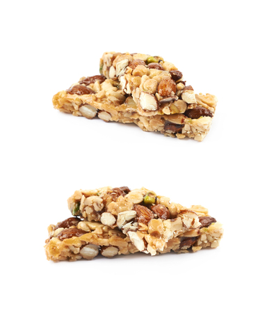 Candied and roasted in sugar nuts bar isolated over the white background, set of two different foreshorteningsの写真素材