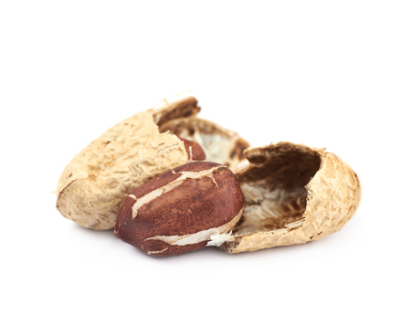 Cracked peanut, composition isolated over the white background