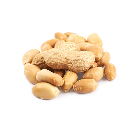 Pile of peanuts isolated over the white background