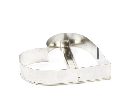 Heart shaped cookie cutter isolated over the white backgroundの写真素材