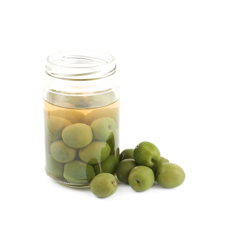 Jar of green olives isolatedの写真素材