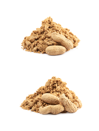 Pile of crushed and crumbled turkish halva confection next to a couple of peanuts, composition isolated over the white background, set of two different foreshorteningsの写真素材