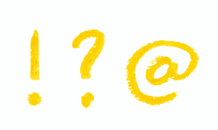 Set of exclamation point, question mark and at internet symbols written with a crayon isolated over the white backgroundの写真素材