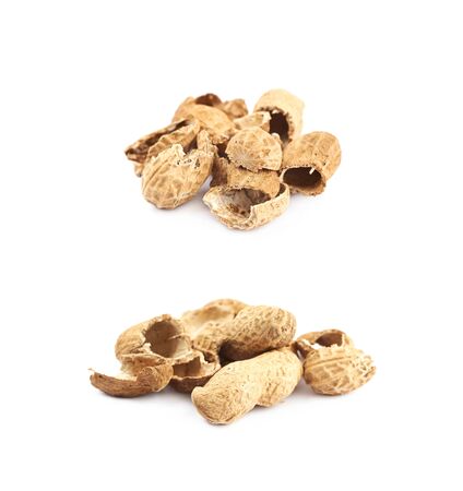 Pile of peanut shells isolated over the white background, set of two different foreshortenings