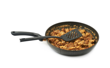 Pan of chicken stew isolated over the white background