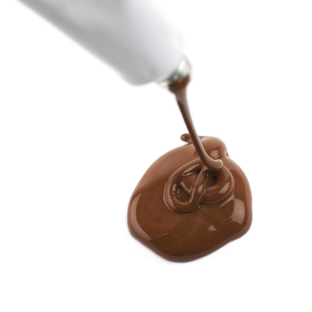 Paint spilling out of a paint tubeの写真素材