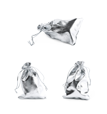 Cloth gift bag with a lace stringing isolated over the white background, set of three different foreshorteningsの写真素材