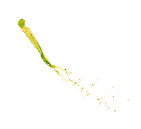 Splash of transparent liquid in motion isolated over the white backgroundの写真素材
