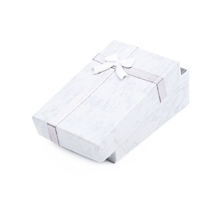 Small gift box with a ribbon bow isolated over the white backgroundの写真素材