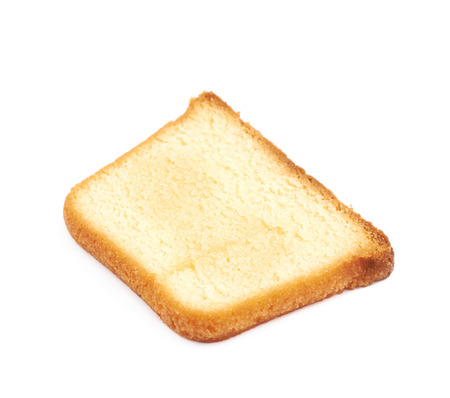 Measured portion of exactly hundred calories of a moist butter cake isolated over the white backgroundの写真素材