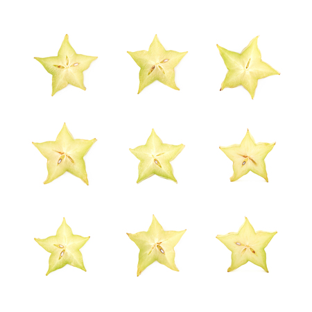 Single cross-section slice of carambola starfruit fruit isolated over the white background