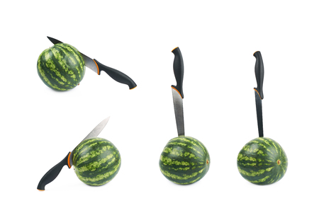 Knife in a watermelon isolated over the white background, set of four different foreshorteningsの写真素材