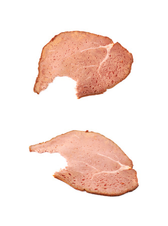 Sliced smoked ham meat isolated over the white background , set of several different foreshorteningsの写真素材