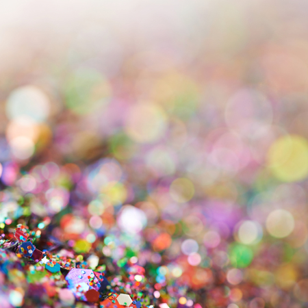 Abstract colorful background composition made of pile of tinsel shot in bokeh as a backdropの写真素材