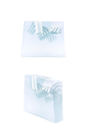 Hande made piece of a flavoured decorational soap isolated over the white background, set of two...