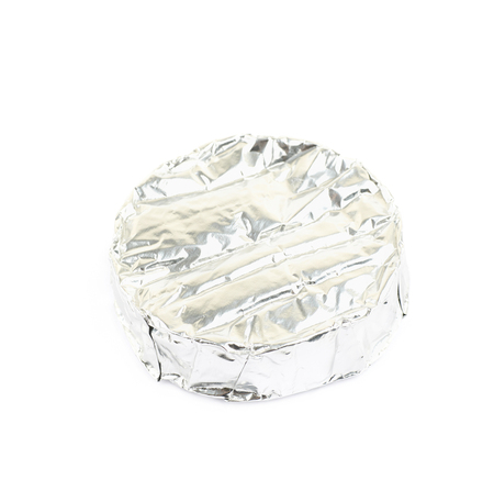 Foil wrapped brie cheese isolated over the white backgroundの写真素材