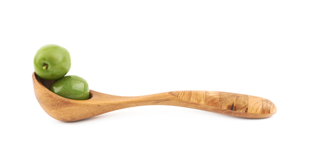 Spoon of olives isolated over the white backgroundの写真素材