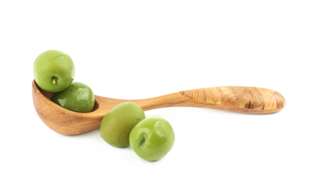 Spoon of olives isolated over the white backgroundの写真素材