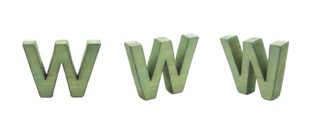 Single sawn wooden W letter symbol in different angles and foreshortenings isolated over the white backgroundの写真素材