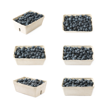 Box full of ripe blueberries isolated over the white background , set of several different foreshorteningsの写真素材