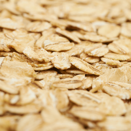 Surface coated with the oatmeal as a backdrop composition texture with the shallow depth of field