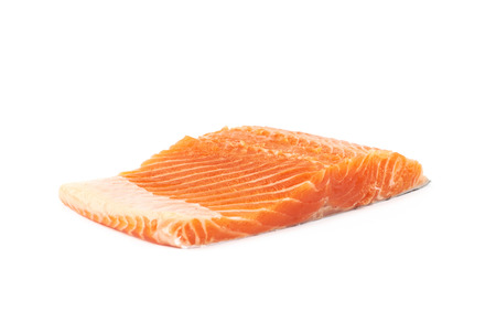 Raw salmon fish fillet fragment isolated over the white backgroundの写真素材