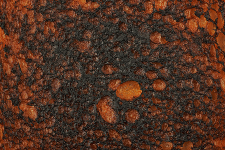 Over-toasted white bread texture fragment as a backdrop close-up compositionの写真素材