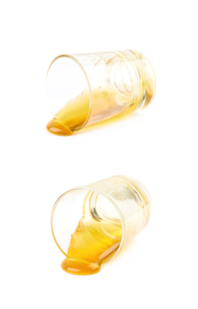 Glass shot of honey isolated over the white background, set of two different compositionsの写真素材