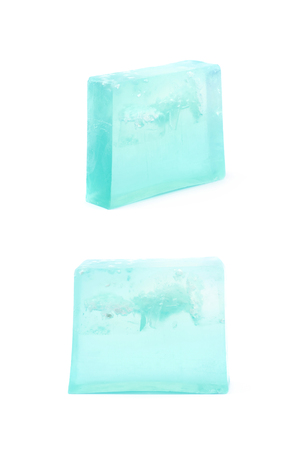 Handmade blue bar of soap isolated over the white background, set of two different foreshorteningsの写真素材
