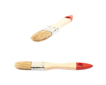 Wide wooden paint brush isolated over the white background, set of two different foreshorteningsの写真素材