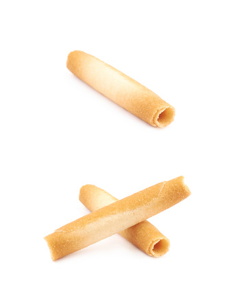 Tube shaped cookie isolated over the white background, set of two different foreshorteningsの写真素材