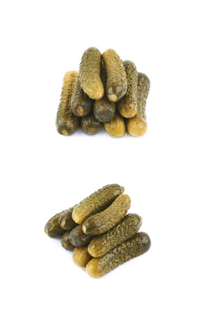 Pile of pickles isolated over the white background, set of two different foreshorteningsの写真素材