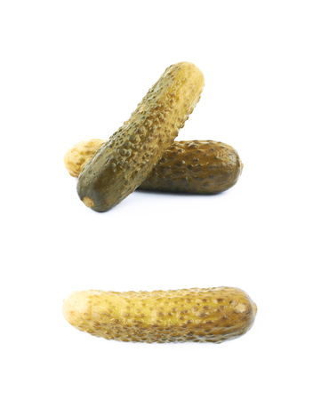 Pile of pickles isolated over the white background, set of two different foreshorteningsの写真素材
