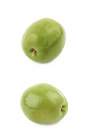 Single olive isolated over the white background, set of two different foreshorteningsの写真素材