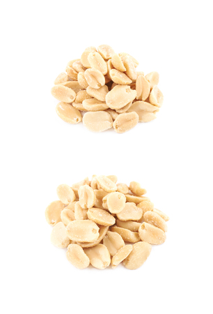 Pile of salted peanuts isolated over the white background, set of two different foreshorteningsの写真素材