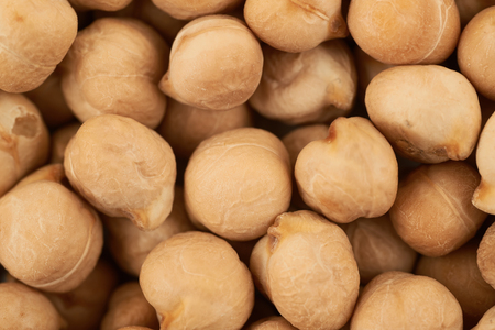 Surface coated with the chick peas, close-up crop fragment as a backdrop texture compositionの写真素材
