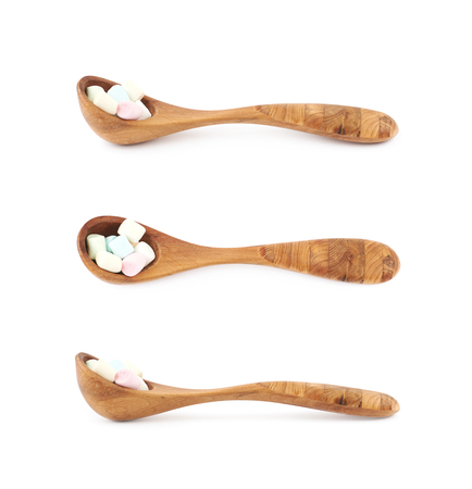 Spoon of mini marshmallows isolatedの写真素材