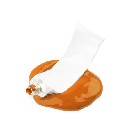 Paint tube in a dye spill isolatedの写真素材