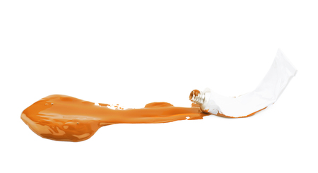 Paint tube in a dye spill isolatedの写真素材
