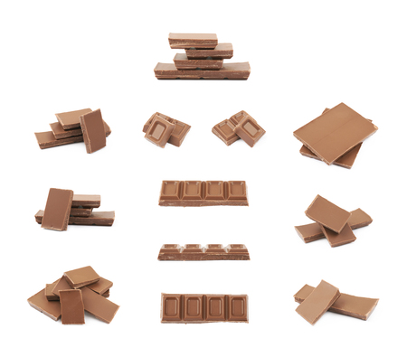 Pile of milk chocolate pieces isolatedの写真素材