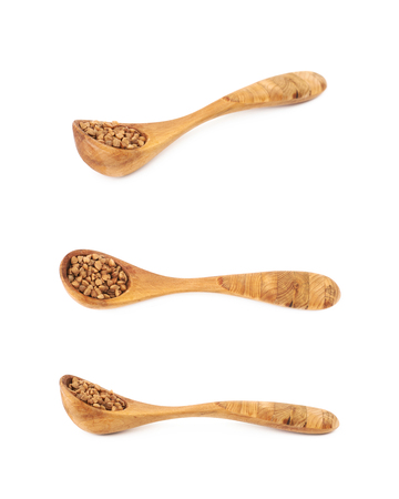 Spoon of buckwheat seeds isolatedの写真素材