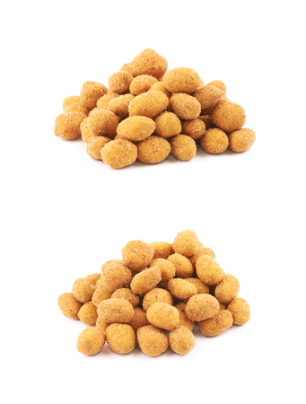 Breadcrumb coated nut pile isolatedの写真素材