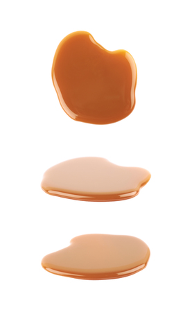 Splash of caramel sauce isolatedの写真素材