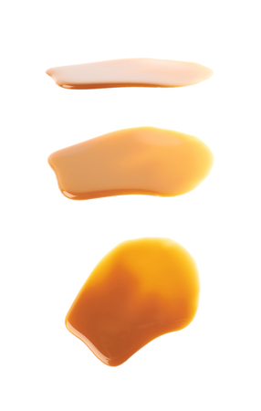 Splash of caramel sauce isolatedの写真素材