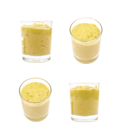 Glass shot of guacamole isolatedの写真素材