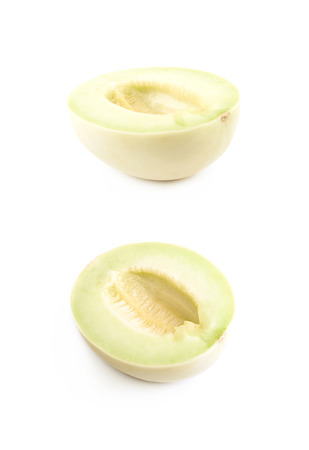 Honeydew melon composition isolated over the white background, set of two different foreshorteningsの写真素材