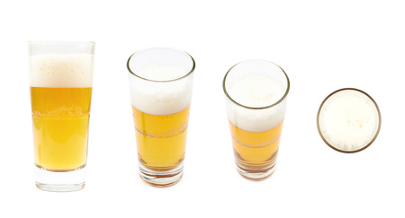 Tall glass of lager beer isolated over the white background, set of four different foreshorteningsの写真素材