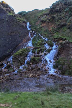 River flowing through a new path down the hillside at Langsett Reservoir, South Yorkshireの写真素材
