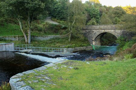 River flowing down the weir at Langsett Reservoir, South Yorkshire. This is at the low bridge.の写真素材