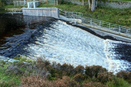 River flowing down the weir at Langsett Reservoir, South Yorkshire. This is at the low bridge.の写真素材